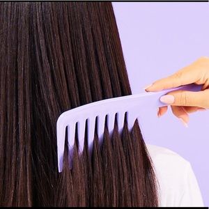 New Monat purple combs includes 2 combs says Monat on the handle